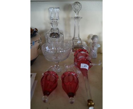 A collection of assorted glassware to include two cut glass decanters with silver-plated labels, also three cranberry glass e