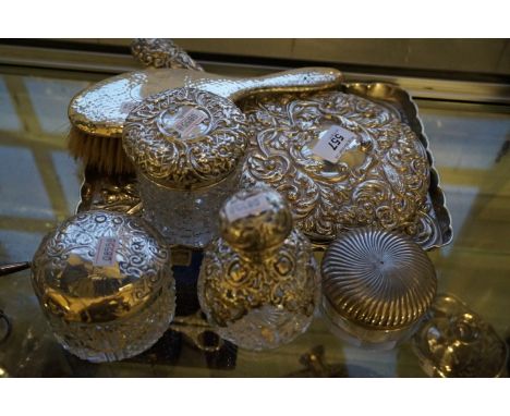 A mixed silver and silver-plate dressing table set comprising hand mirror, hairbrush, tray, three dressing table pots and a h