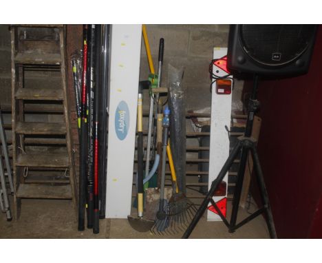 A bundle of tools to include a rake; a shovel; a set of drain rods etc.
