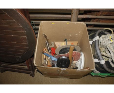 A box containing tools to include a hacksaw; an axe; a cable reel; a wooden mallet etc.