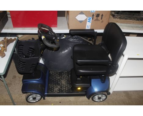A Mobility Plus mobility scooter with front basket and charger (Key with auctioneer)