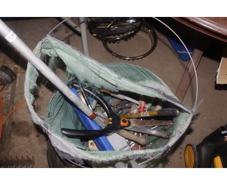 A bag containing a quantity of tools to include screwdrivers; garden shears; secateurs etc.