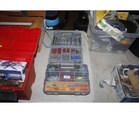 A cased drill bit set including wall plugs with a further cased set of nails and fixings