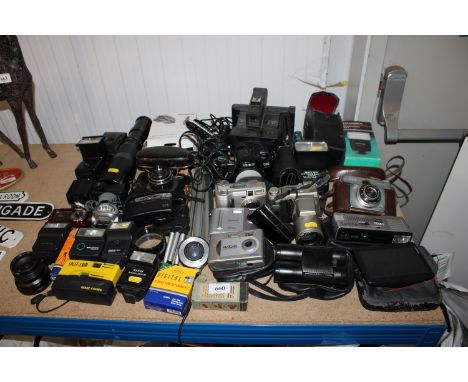 A collection of various cameras to include Canon, Minolta, Illford together with various accessories to include lenses etc.