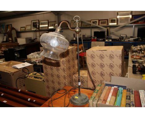 A brass table lamp and shade