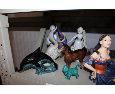 A collection of various ornaments to include Poole pottery dolphin, a model of a horse together with various figurines 