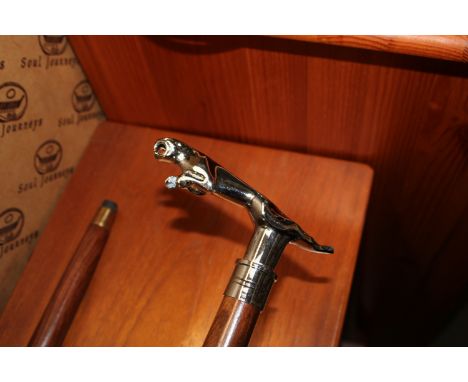 A walking stick, having Jaguar car mascot handle (61)