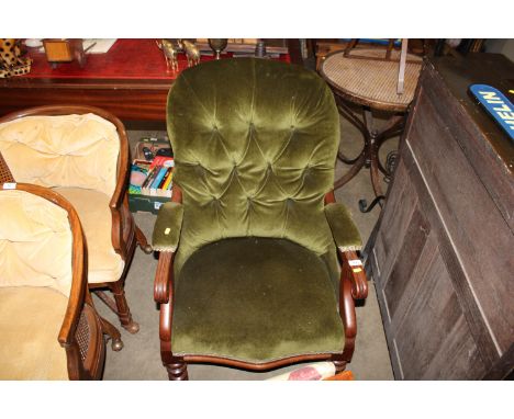 A Victorian button down upholstered armchair