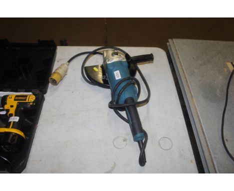 A Makita GA9050 110V angle grinder