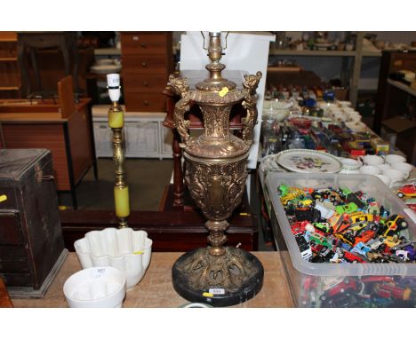 A brass figural table lamp, having twin handles, raised on marble base AF