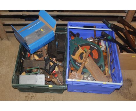 Two boxes containing various tools to include saws, mallets, spanners etc. 