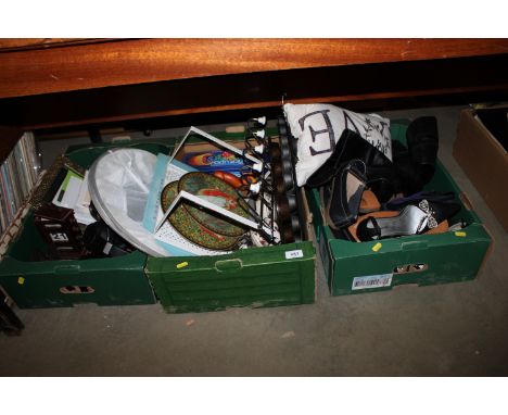 Three boxes containing various shoes; kitchenalia; placemats; clocks etc.