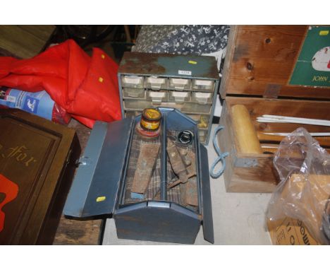 A tool box with contents of tools to include a miniature bench vice; a grease gun and a set of small workshop drawers contain