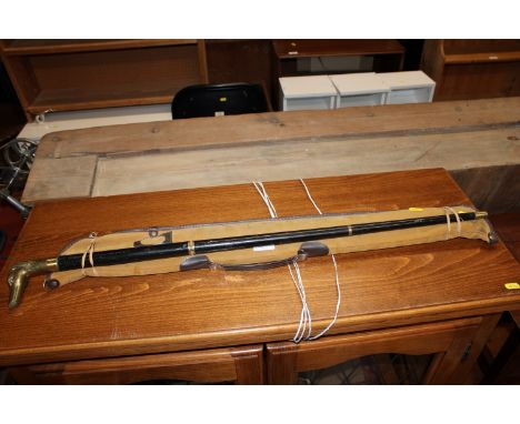 A walking stick, having figural handle; together with a snooker cue