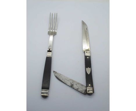 Vintage folding knife and fork, the knife having a steel and silver blade, ebony scales, white metal bolsters, silver stamps 
