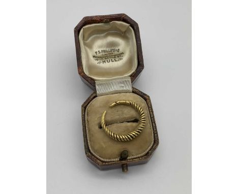 A Middle Eastern Style Ring, of twist design, in a vintage ring box.The ring weighs 3.3 grams, the carat is unknown but we be