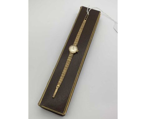 Rotary; A 9ct Gold Cased Ladies Wristwatch, the signed dial with line markers, within plain case, to integral textured taperi