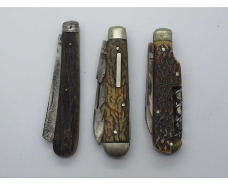Lockwood Brothers, Sheffield, one blade brass lining, stag scales 9.5cm, Sheffield I Cut My Way, two blades, awl, corkscrew, 