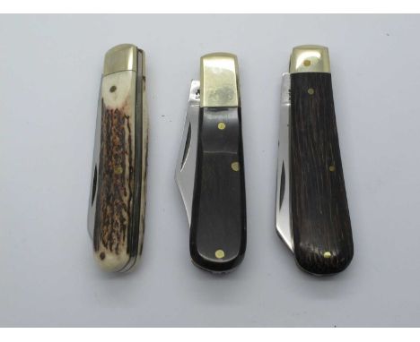 A. Wright Sheffield, single blade, polished horn scales, large brass bolster, brass linings, work back 9cm - one other simila