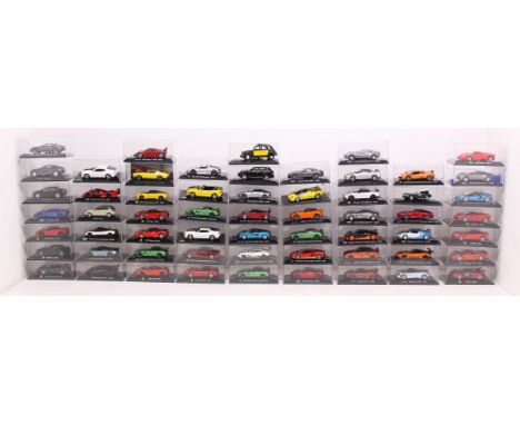 Diecast: A collection of over 50 cased diecast vehicles, mostly Panini Supercars 1:43 Scale. Vehicles generally in very good 