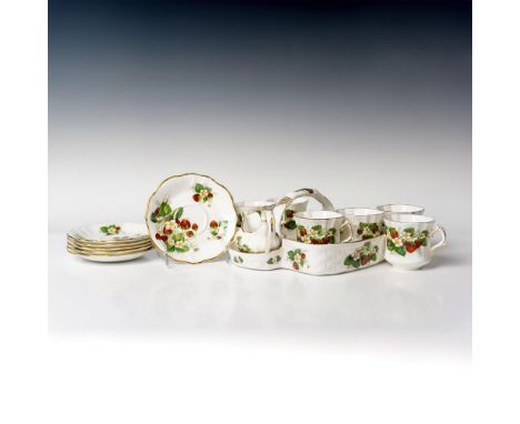 Colorful set designed with blooming strawberries and gilt accents. Lot includes serving basket 10.5", cream jug, sugar bowl, 