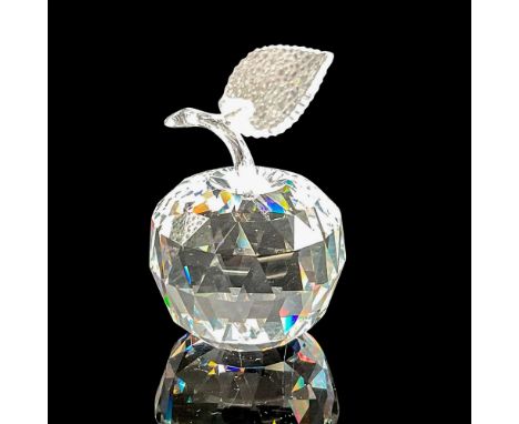 Clear faceted body with clear smooth stem, jagged leaf edge. Swarovski backstamp. 7476 000 001. This item has its original bo