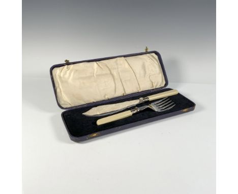 A silver set of a fish knife and fork intricately embellished with delicate line art, elegantly complemented by beige handles