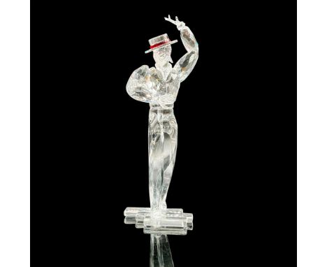 This Swarovski crystal item, Antonio, is part of the Magic of Dance trilogy and is made of clear crystal. The ribbon of his h