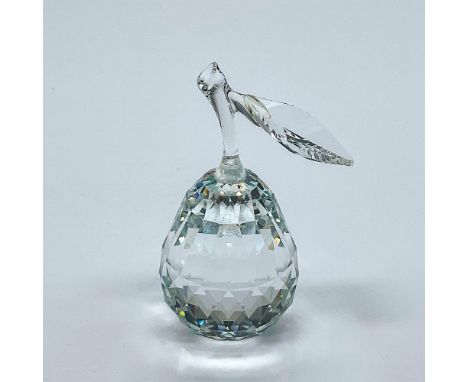 Multifaceted clear crystal pear with stem and single leaf, part of the Sparkling Fruit Collection. Number 7476 000 002. Swaro