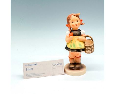 Lovely little girl holding basket. Hand painted with orange bows and yellow pinafore. Goebel backstamp. M.I. Hummel impressed