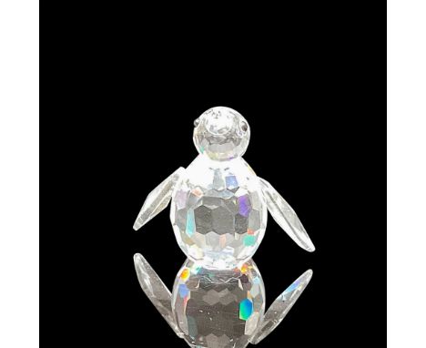 Part of the Kingdom of Ice and Snow theme group. This clear faceted crystal figural is standing with flippers down, looking u