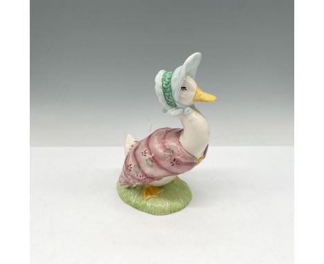 This beloved figure is hand painted in bright colors of rose, green and yellow. Dressed in her shawl and hat. Beswick Beatrix