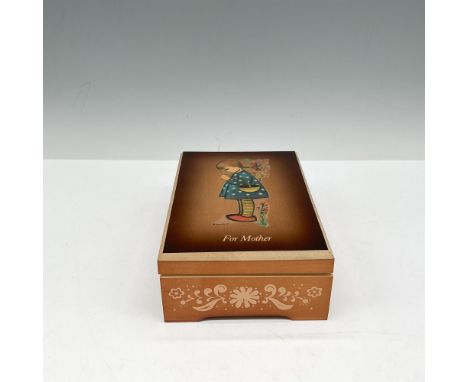 Decorated wooden box with little girl in prayer on lid. Music box plays The Most Beautiful Girl In The World. Hummel and Anri