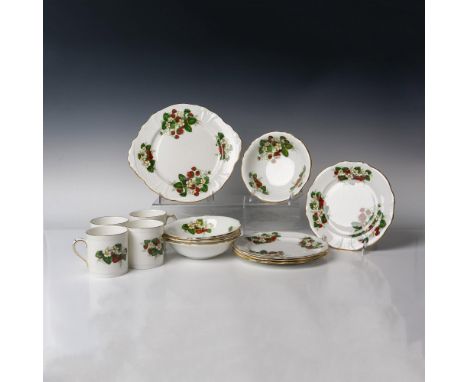 Colorful strawberry design with gilt rims. Set includes Cake plate 13", 4 - dessert bowls 7", 4 - dessert plates 8" and 4 cup