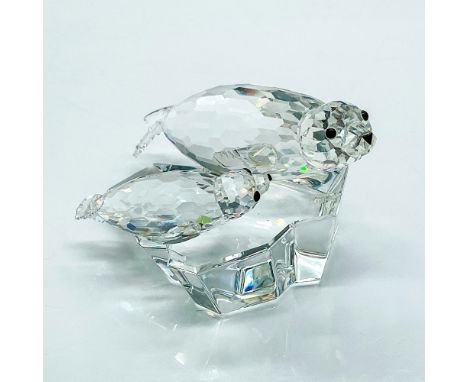 Multifaceted clear crystal seals with black eyes on an ice floe, part of the Mother and Child series. Certificate of Authenti