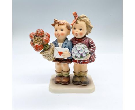 Hand painted figure of a boy and girl celebrating Hummel 50th anniversary. Goebel backstamps. Issued: 20th centuryDimensions: