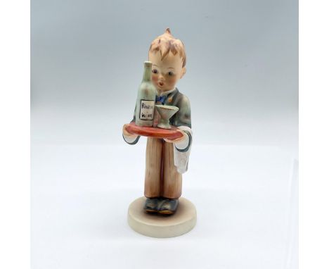 Hand painted figure of a young boy serving a bottle of wine. Goebel backstamp. Issued: 20th centuryDimensions: 3.5"L x 2.5"W 