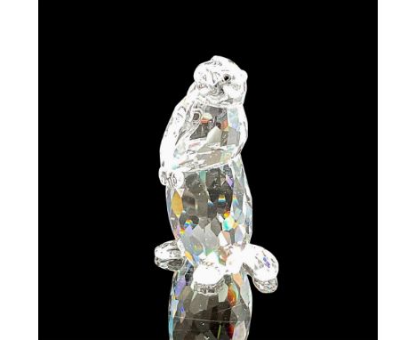 Sitting clear crystal body, paws in front with black inset eyes. 7608 000 005. Swarovski backstamp. This item has its origina