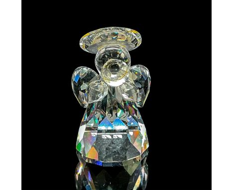 Clear faceted crystal figure of an angel with halo and wings. Swarovski mark. Item number 7475NR000009. Part of the Nativity 