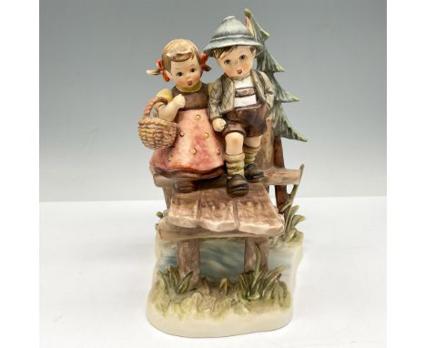 Part of the Century Collection this figural is set in outdoor scene walking on a bridge. Soft glossy finish over peach, green