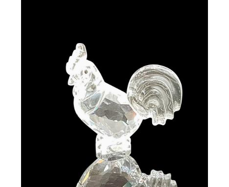 Part of the Chinese Zodiac collection. This clear crystal figural has black inset eyes, large, furled tail and detailed comb 