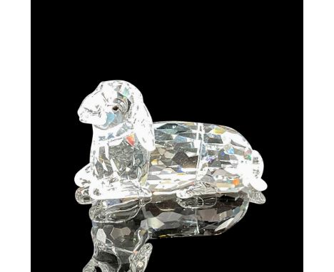 Clear crystal body on sweet faced figural looking out with jet crystal eyes. Swarovski backstamp. 631437. This item has its o