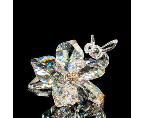 Dazzling clear faceted crystal figure of a bee hovering over an orchid. SCS 2007 20th Anniversary celebration piece. Item num