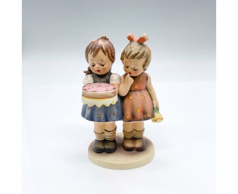 Hand painted figure of two girls. One girl is holding a pink cake, and the other girl holding flowers. Goebel backstamp. Issu