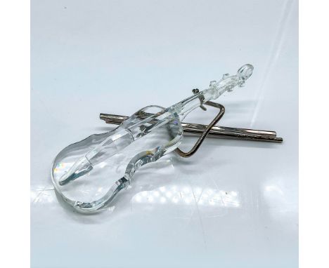 Multifaceted clear crystal violin. This piece comes with rhodium metal bow and stand. Swarovski etched backstamp. This item h