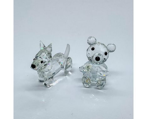 Multifaceted clear crystal with black eyes and noses. Terrier has a frosted tail. Swarovski etched backstamp. These item have