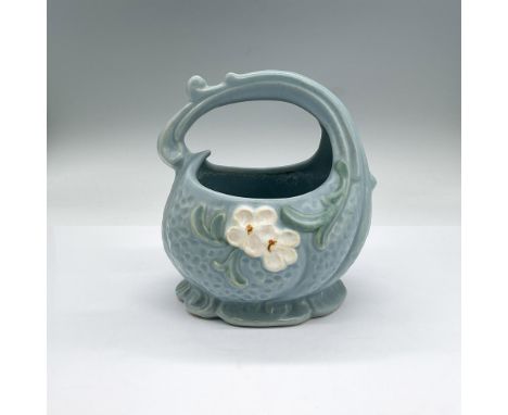 Earthenware basket style vase in a light blue with white flowers in low-relief. Weller Pottery mark. Dimensions: 6"L x 5.75"W