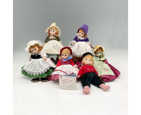 All dolls created of hard plastic with moveable arms and legs. 3 have individual stands. All international dolls decorated an