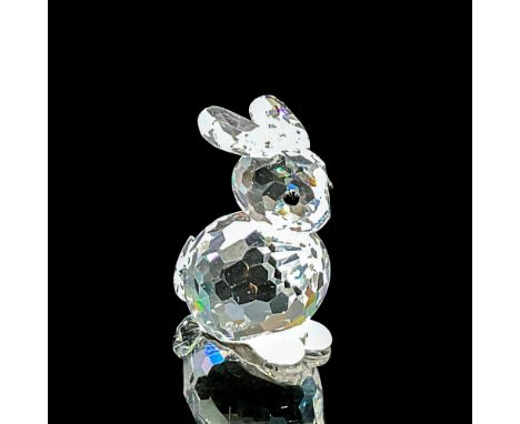 Clear faceted crystal figure of a seated rabbit with black eyes. Swarovski mark. Item number 7678NR040. Part of the In A Summ