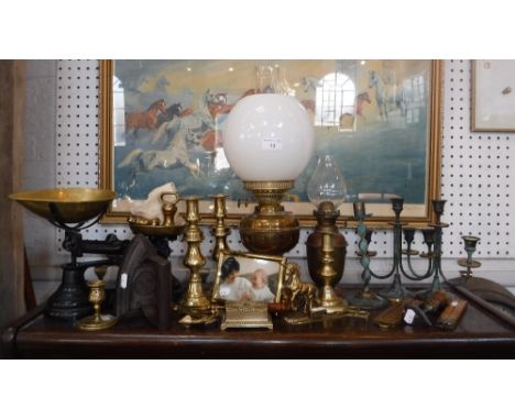 A BRASS OIL LAMP, candlesticks and similar metalware